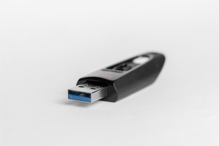 A USB stick lying on a desk: a reminder to avoid using unknown removable storage to prevent ransomware